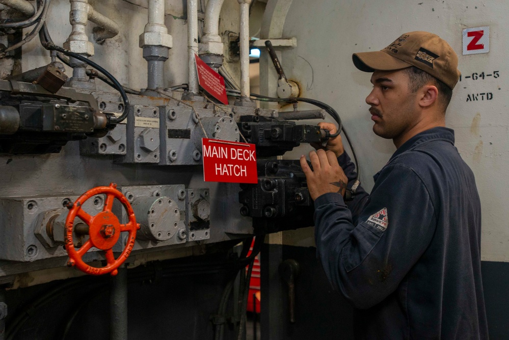 U.S. Navy Sailor Troubleshoots Elevator