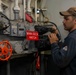 U.S. Navy Sailor Troubleshoots Elevator