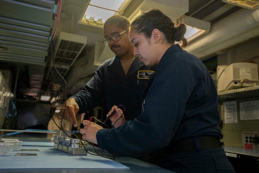 U.S. Navy Sailors Troubleshoot Testing Equipment