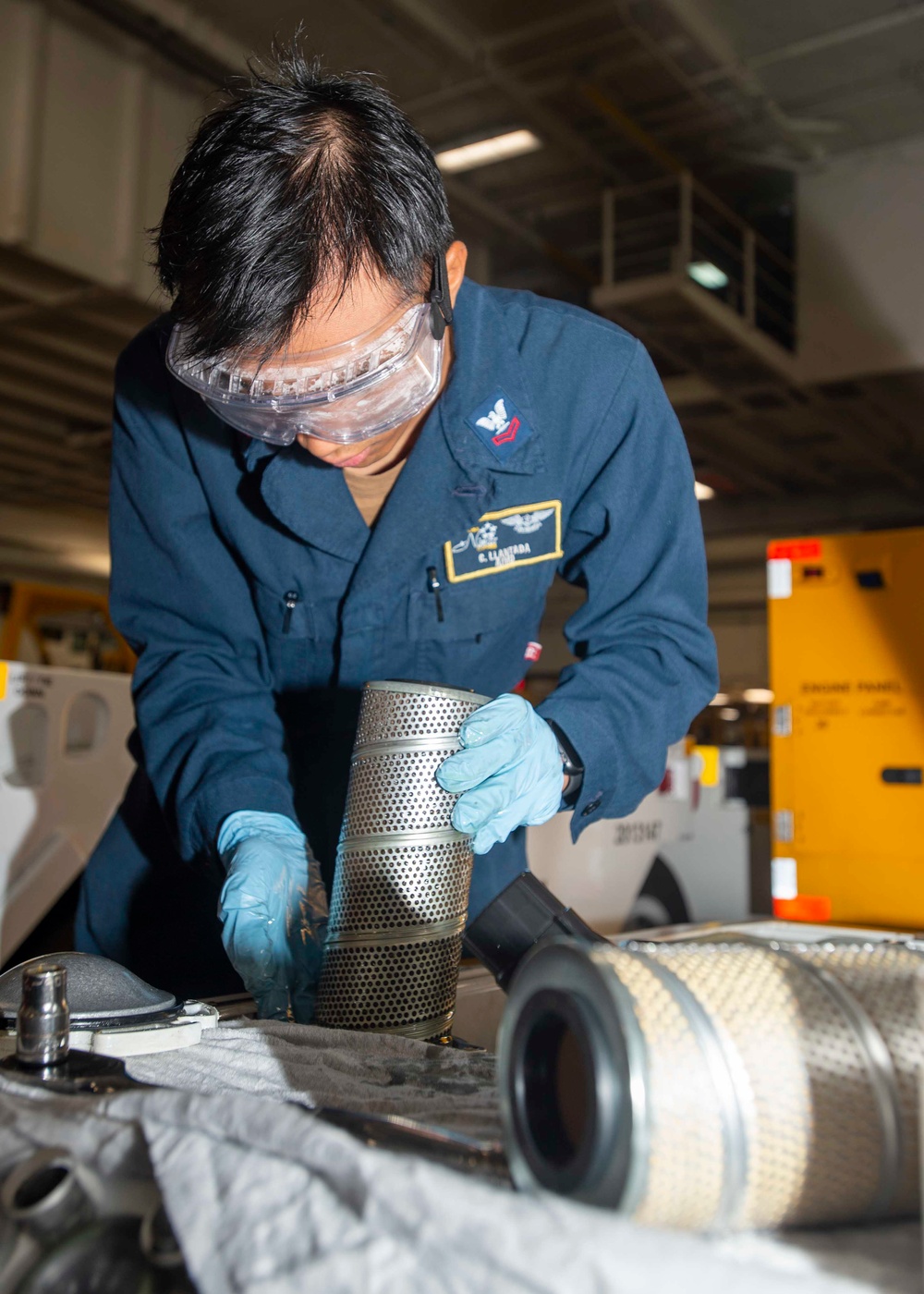 Sailor Removes Hydraulic Filter