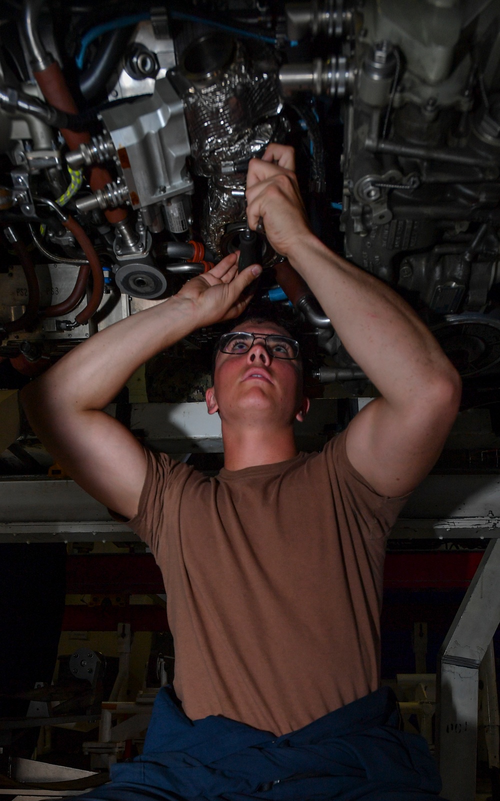 Sailor Installs Heat shielding on Jet Engine