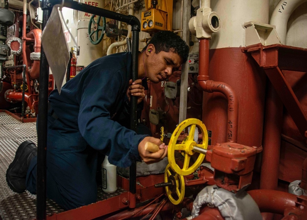 U.S Sailor Cleans Valve Labels