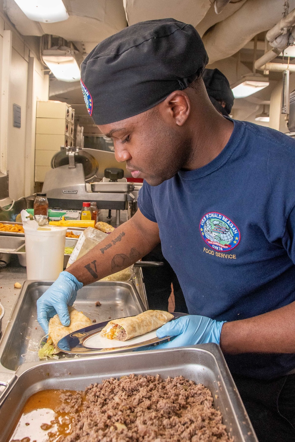 USS Ronald Reagan (CVN 76) Sailors participate in a cook-off