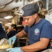 USS Ronald Reagan (CVN 76) Sailors participate in a cook-off