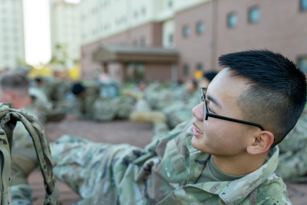 Soldiers from 1st Signal Brigade go on a ruck march for physical training in the morning.