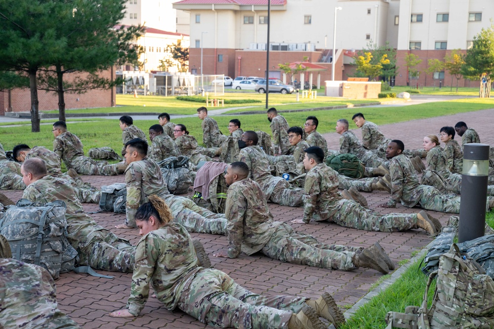 Soldiers from 1st Signal Brigade go on a ruck march for physical training in the morning.