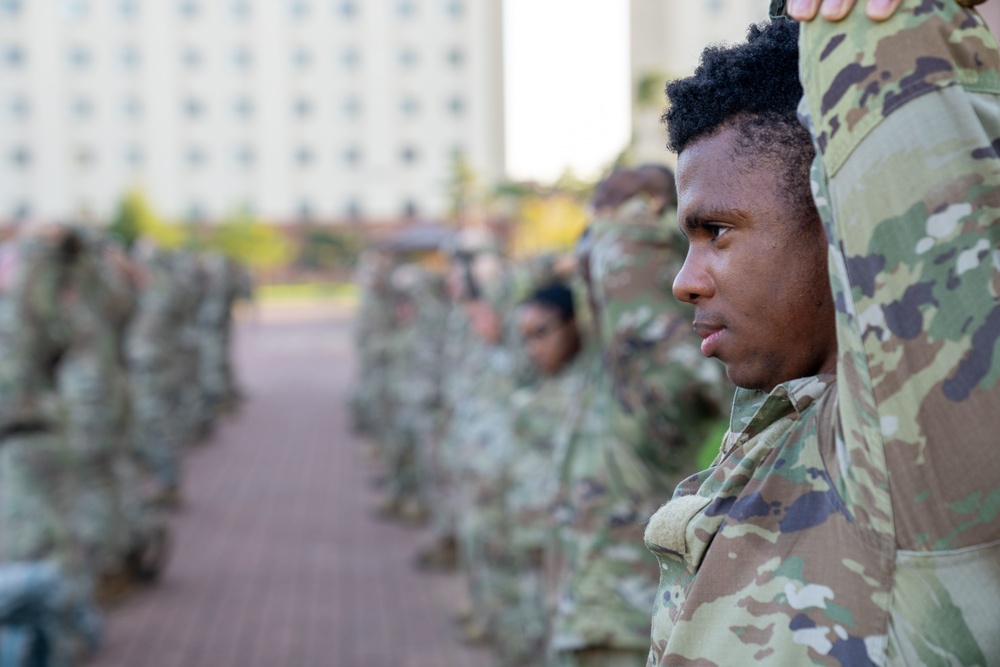 Soldiers from 1st Signal Brigade go on a ruck march for physical training in the morning.