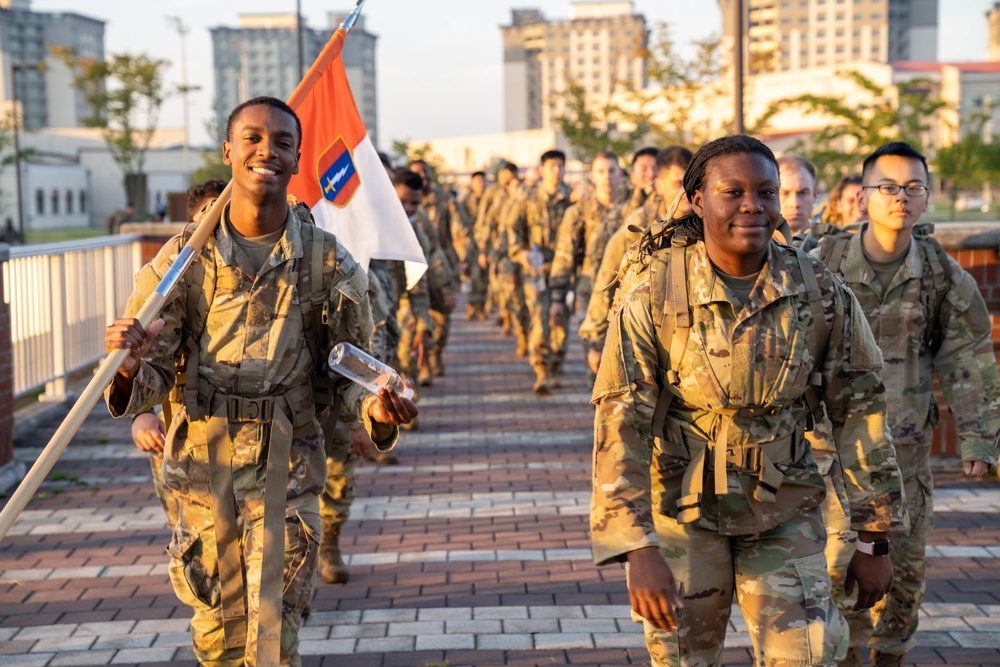 Soldiers from 1st Signal Brigade go on a ruck march for physical training in the morning.