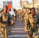 Soldiers from 1st Signal Brigade go on a ruck march for physical training in the morning.