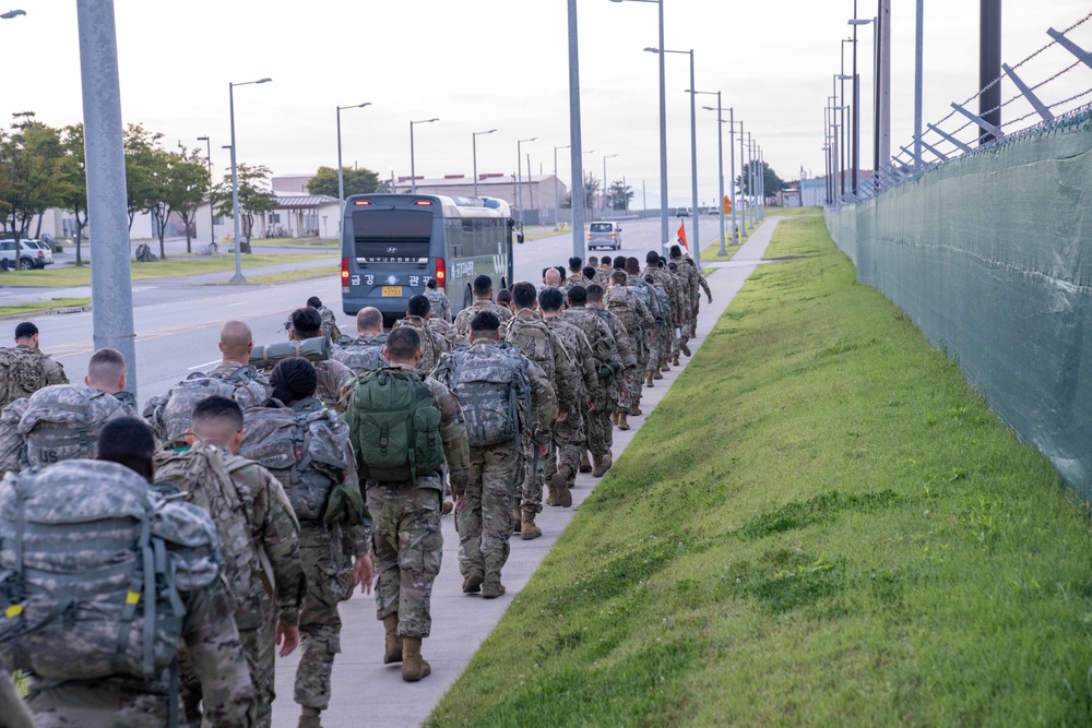 Soldiers from 1st Signal Brigade go on a ruck march for physical training in the morning.