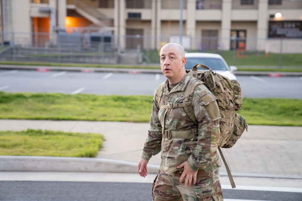 Soldiers from 1st Signal Brigade go on a ruck march for physical training in the morning.