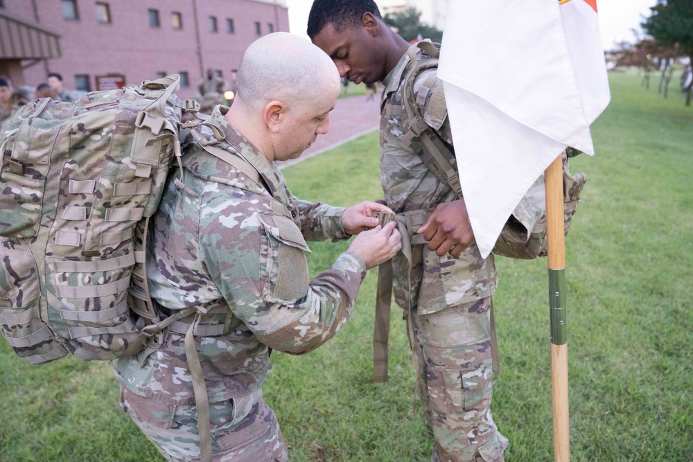 Soldiers from 1st Signal Brigade go on a ruck march for physical training in the morning.