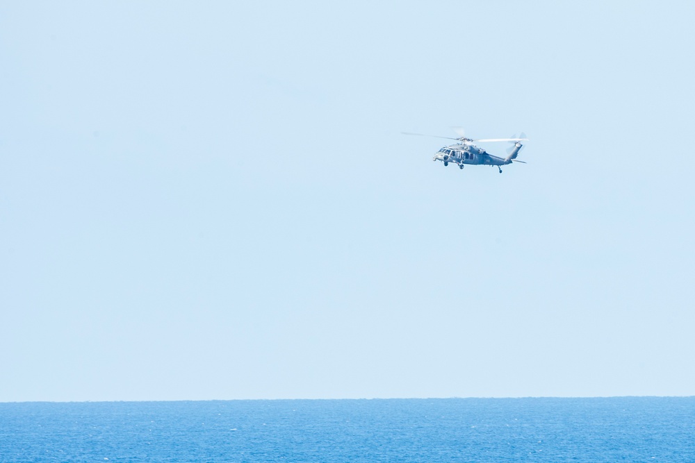 An MH-60S Sea Hawk Helicopter Patrols The Sea