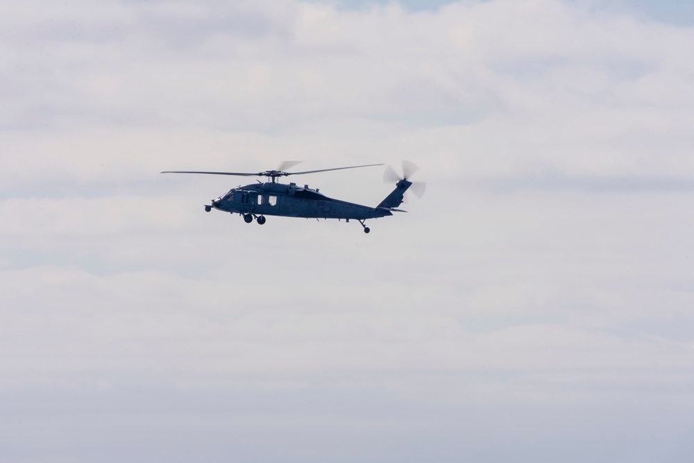 An MH-60S Sea Hawk Helicopter Patrols The Sea