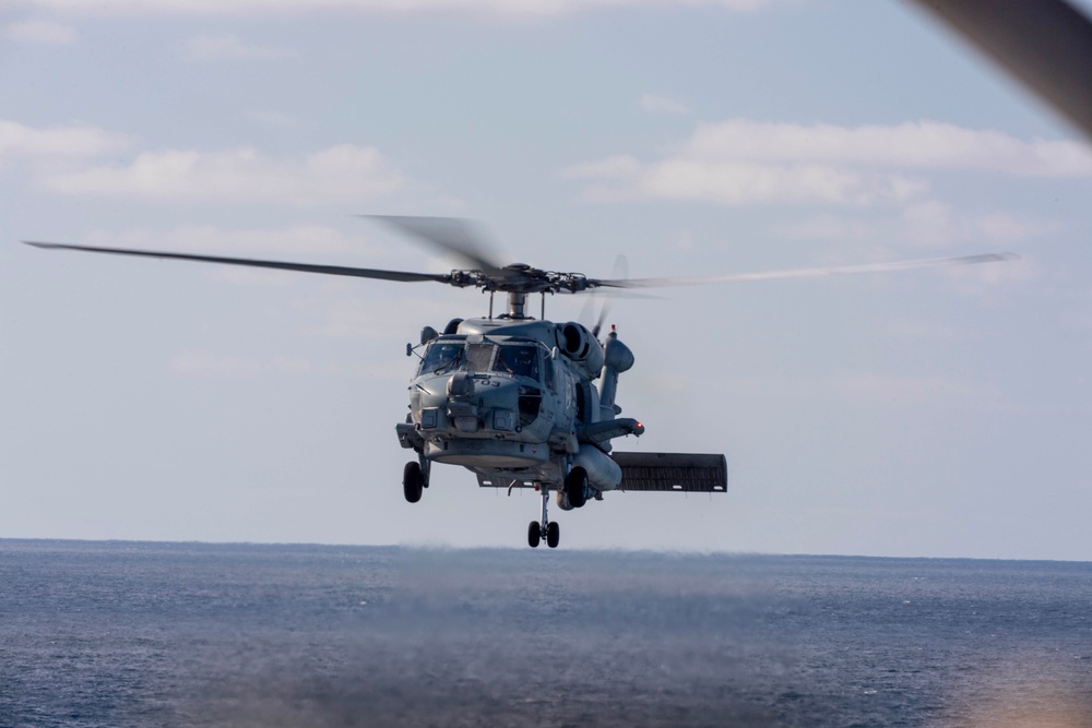 An MH-60R Sea Hawk Helicopter Patrols The Sea