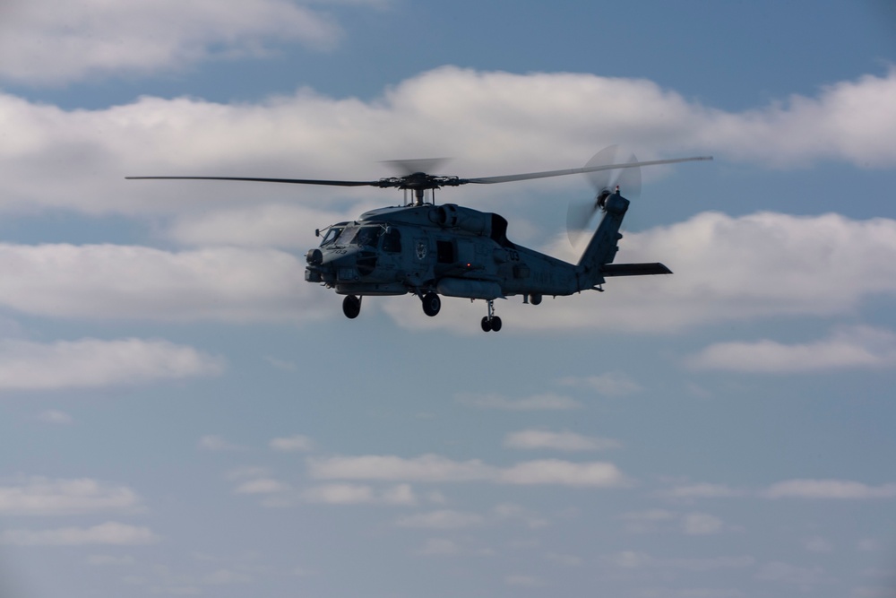 An MH-60R Sea Hawk Helicopter Patrols The Sea