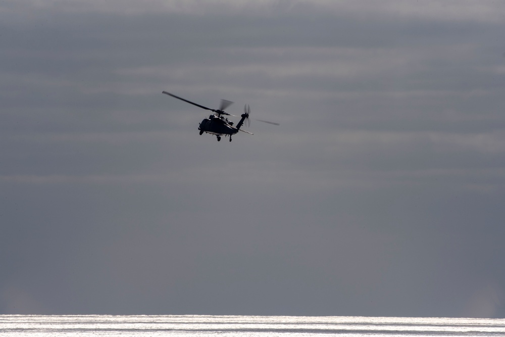 An MH-60S Sea Hawk Helicopter Patrols The Sea