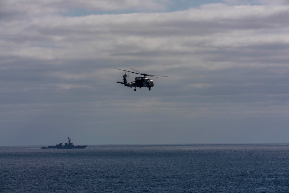 An MH-60R Sea Hawk Helicopter Patrols The Sea