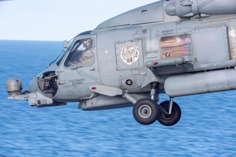 An MH-60R Sea Hawk Helicopter Patrols The Sea