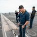 Sailor Checks Gauge