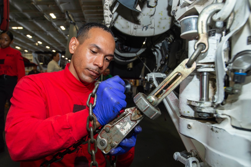 Sailor Removes Chains from Aircraft