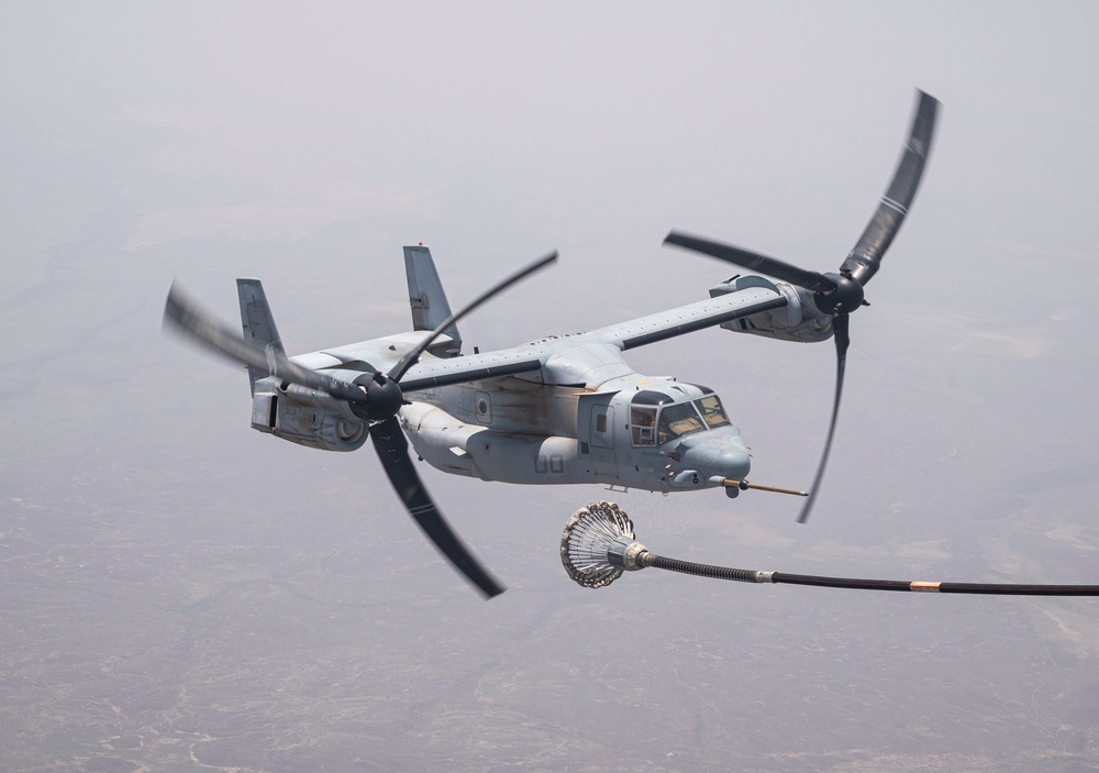 81st ERQS HC-130J conducts tactical air refueling with VMM-163 MV-22s