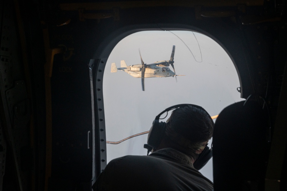 81st ERQS HC-130J conducts tactical air refueling with VMM-163 MV-22s