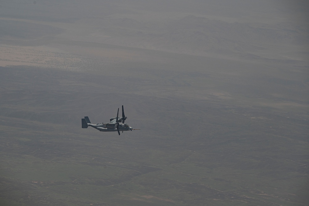 81st ERQS HC-130J conducts tactical air refueling with VMM-163 MV-22s