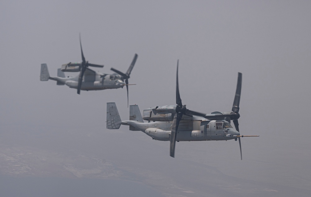 81st ERQS HC-130J conducts tactical air refueling with VMM-163 MV-22s