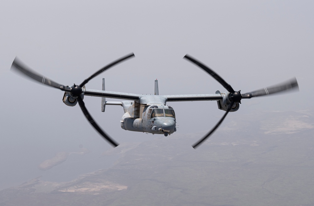 81st ERQS HC-130J conducts tactical air refueling with VMM-163 MV-22s