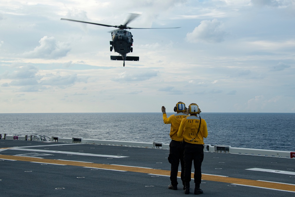 USS America (LHA 6) Conducts Flight Operations with Helicopter Sea Combat (HSC) Squadron 25