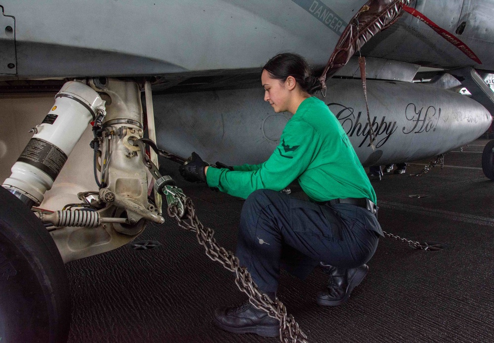 USS Ronald Reagan (CVN 76) Sailors in the AIMD tunnel and hangar bay