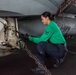 USS Ronald Reagan (CVN 76) Sailors in the AIMD tunnel and hangar bay