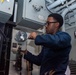 USS Ronald Reagan (CVN 76) Sailors reinstall gauges on AFFF station 6