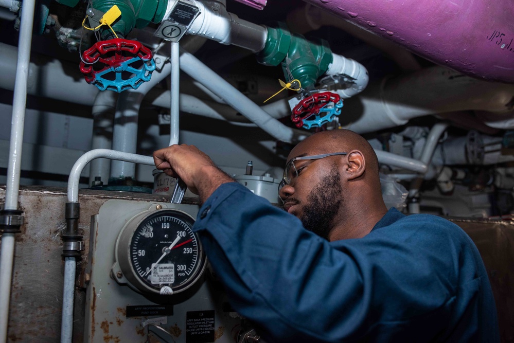 USS Ronald Reagan (CVN 76) Sailors reinstall gauges on AFFF station 6