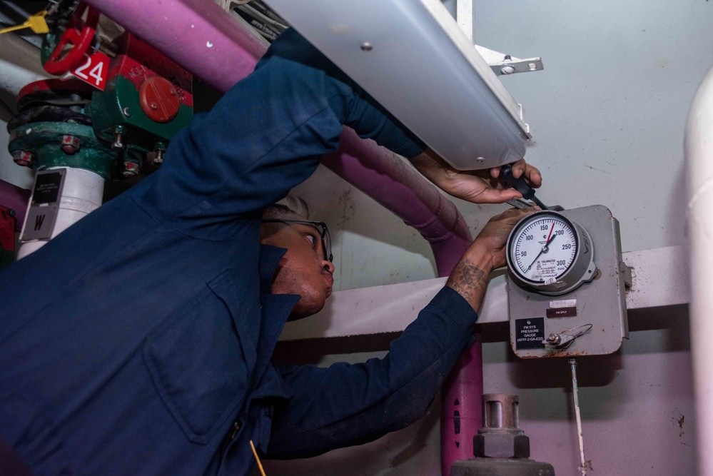 USS Ronald Reagan (CVN 76) Sailors reinstall gauges on AFFF station 6