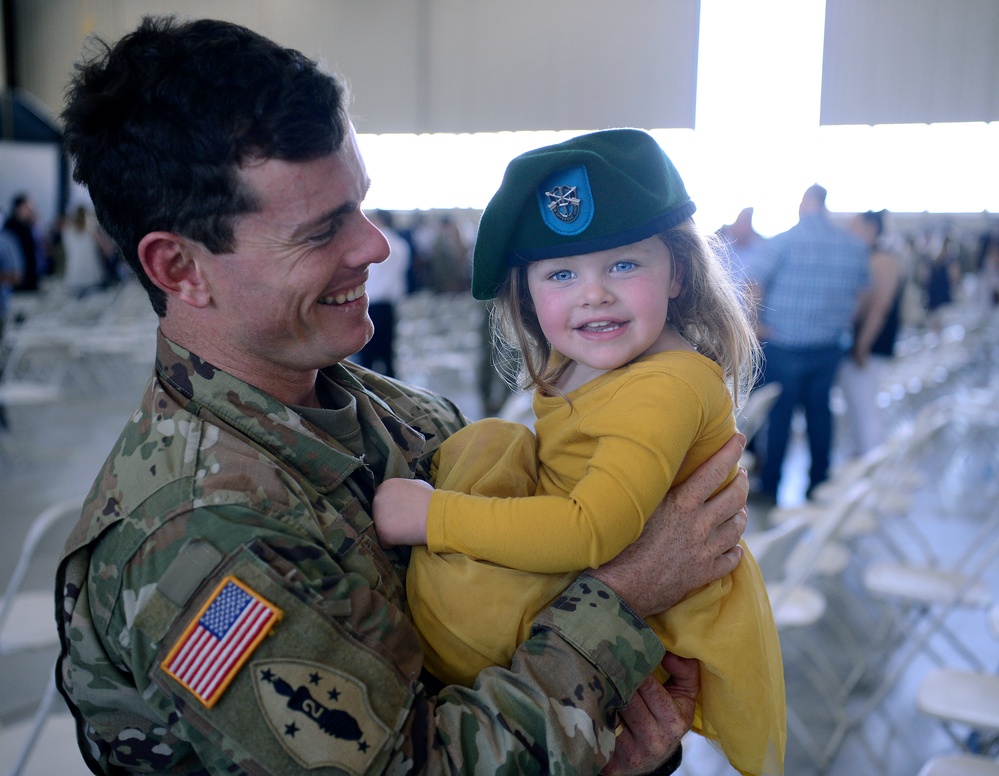 Soldiers Don Green Beret at Ceremony