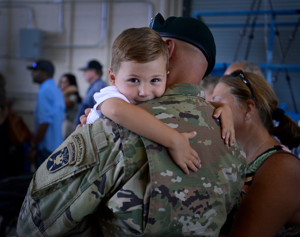 Soldiers Don Green Beret at Ceremony