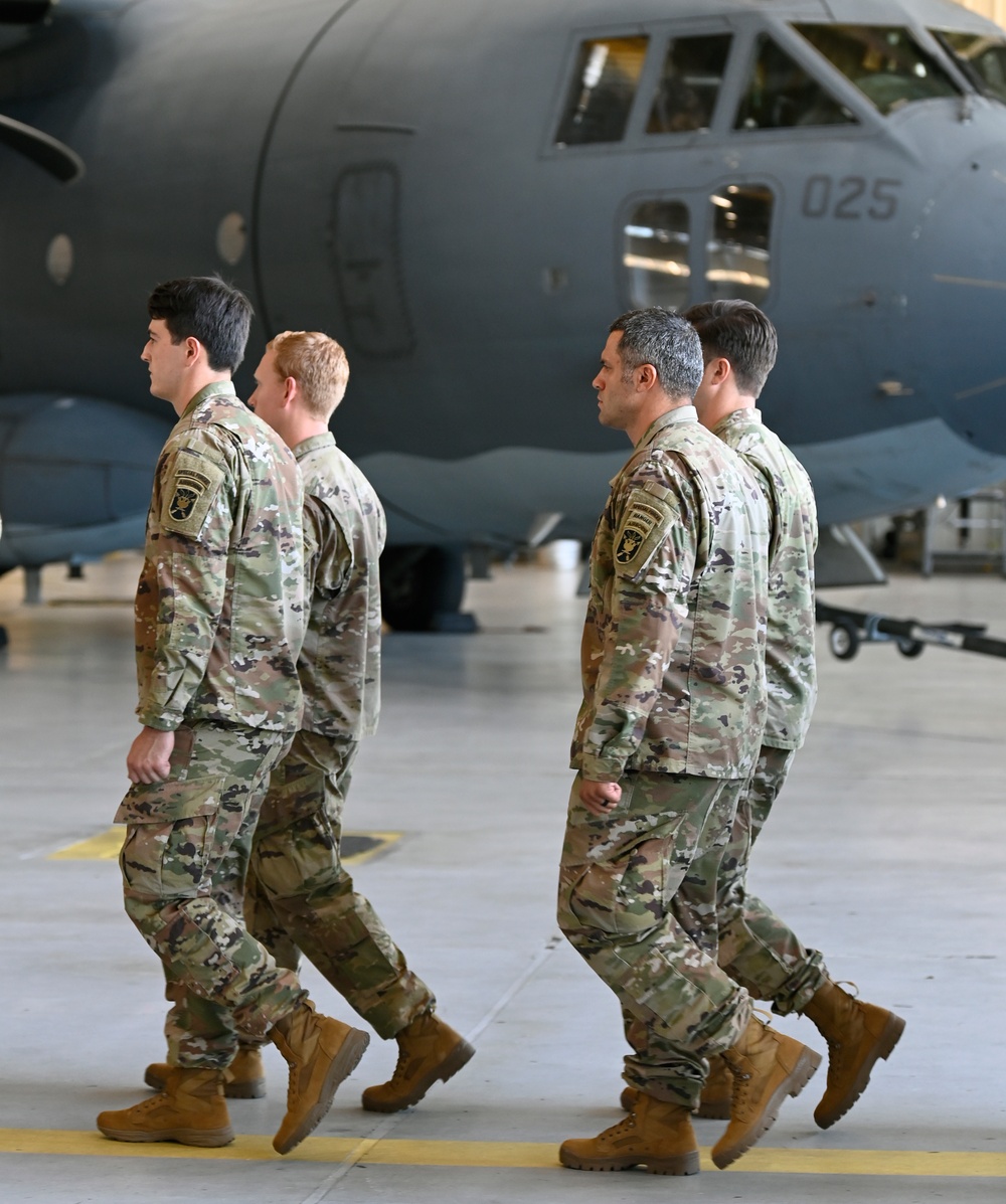 Soldiers Don Green Beret at Ceremony