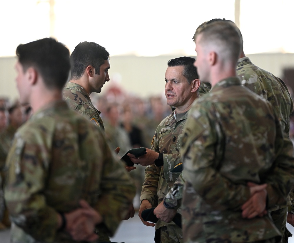 Soldiers Don Green Beret at Ceremony