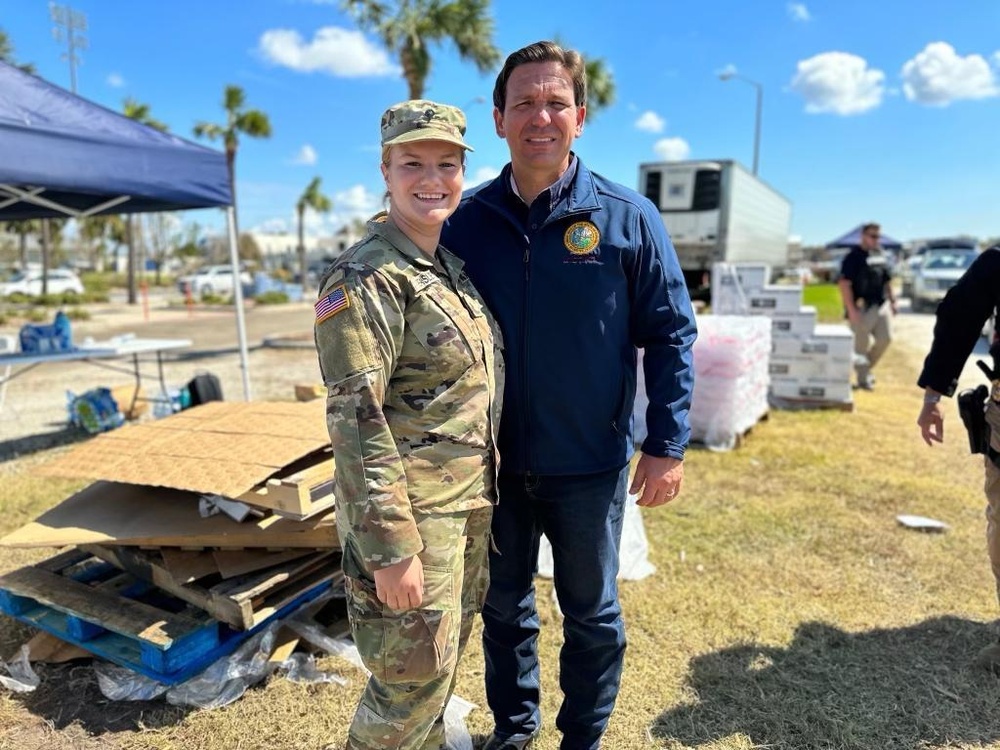 Ron DeSantis meets national guard soldiers handing out supplies after Hurricane Ian.