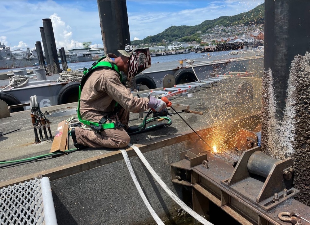 UCT 2 Repairs at Akasaki Wharf U.S. Navy Fuel Station Akasaki in Sasebo, Japan