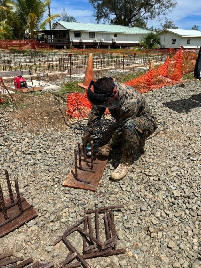 Lance Cpl. Armando Gorosavevacio with 7th Engineering Support Battalion, repurpose steel plating for base pedestals of new living units at Camp Katuu.