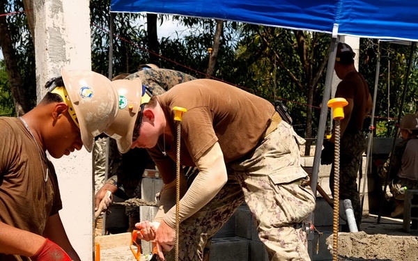 Seabees in Phước Hòa, Vietnam lay the first of 15 courses of Concrete Masonry Units block for the Phước Hòa primary school.