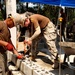 Seabees in Phước Hòa, Vietnam lay the first of 15 courses of Concrete Masonry Units block for the Phước Hòa primary school.