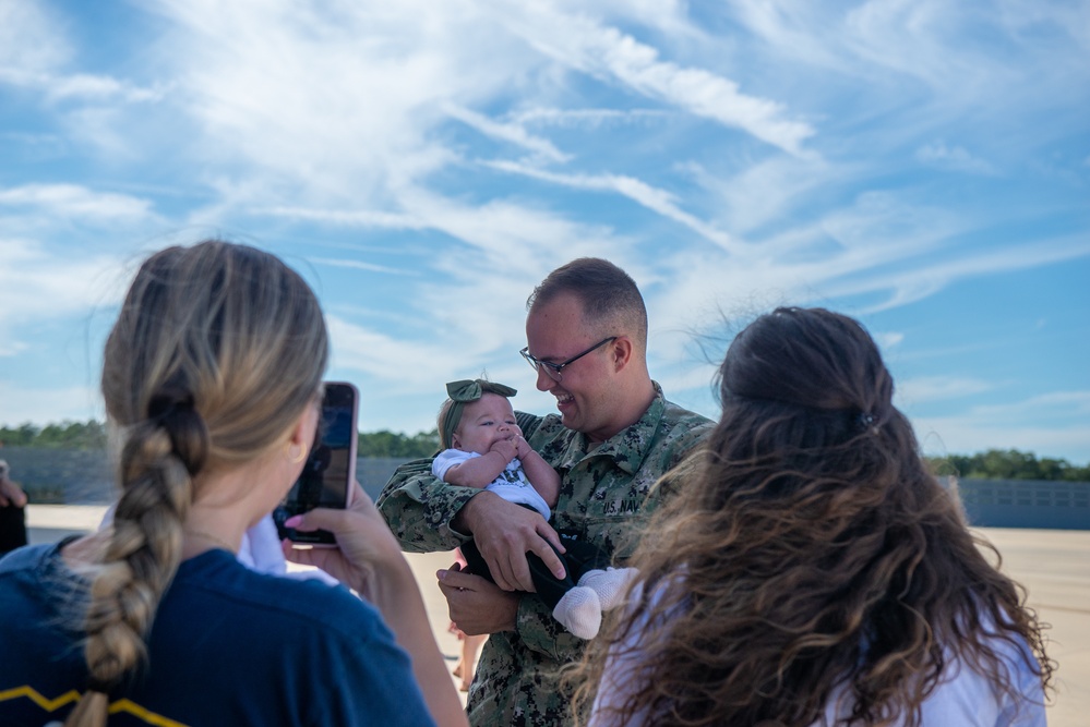 AE3 Wolfe Reunited with Family Following 6 Month Deployment