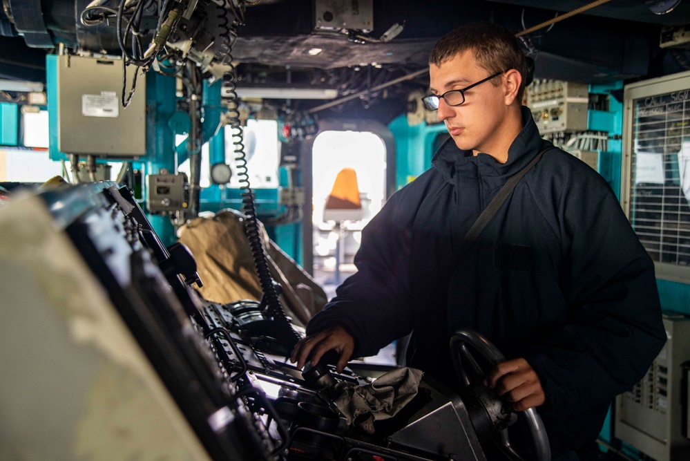 U.S. Navy Sailor Mans The Helm