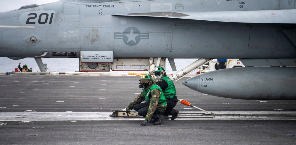 Two Sailors Prepare To Lock Super Hornet Into Catapult