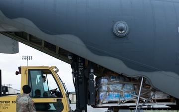 Alaska Air National Guardsmen load relief supplies for Operation Merbok Response