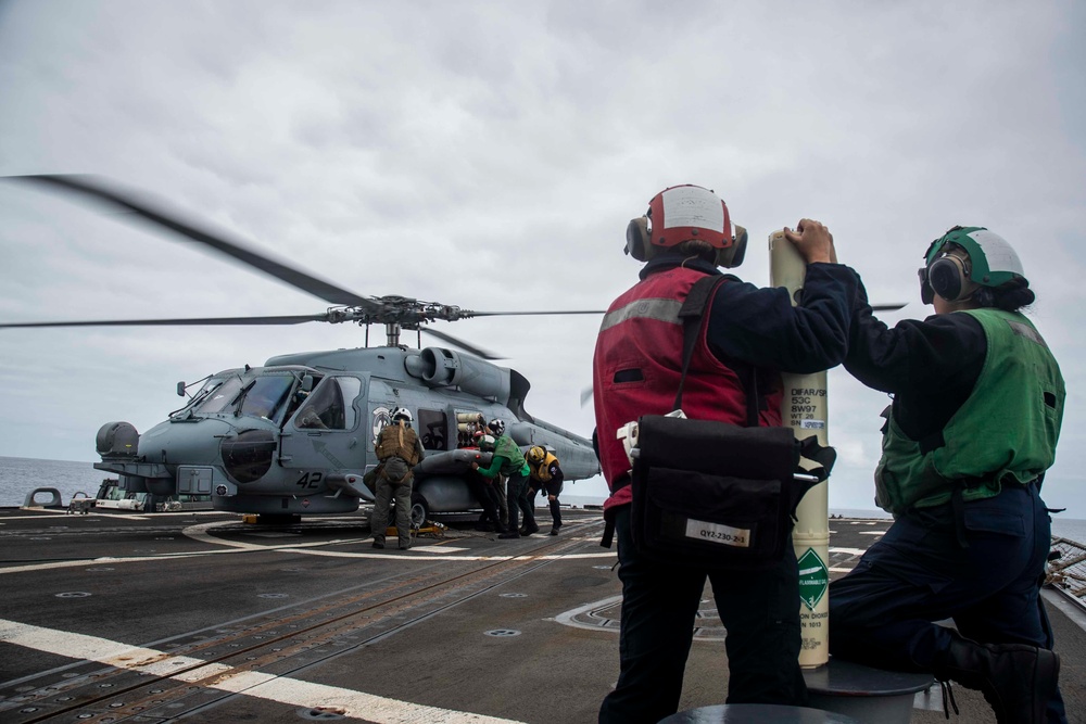 U.S. Sailors Load Radar Equipment Onto An MH-60R Sea Hawk Helicopter